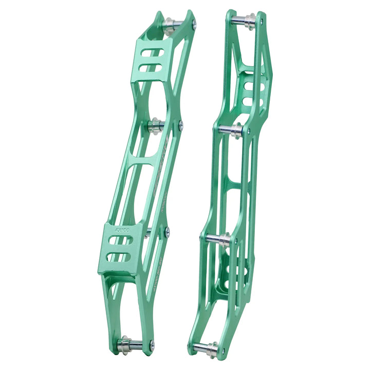 Two green metal bike frames on a white background