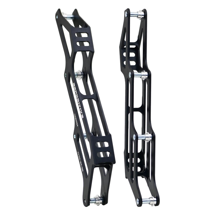 Pair of black metal bike frames on a white background