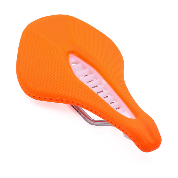 angled view of orange Stratos bicycle saddle on a white background