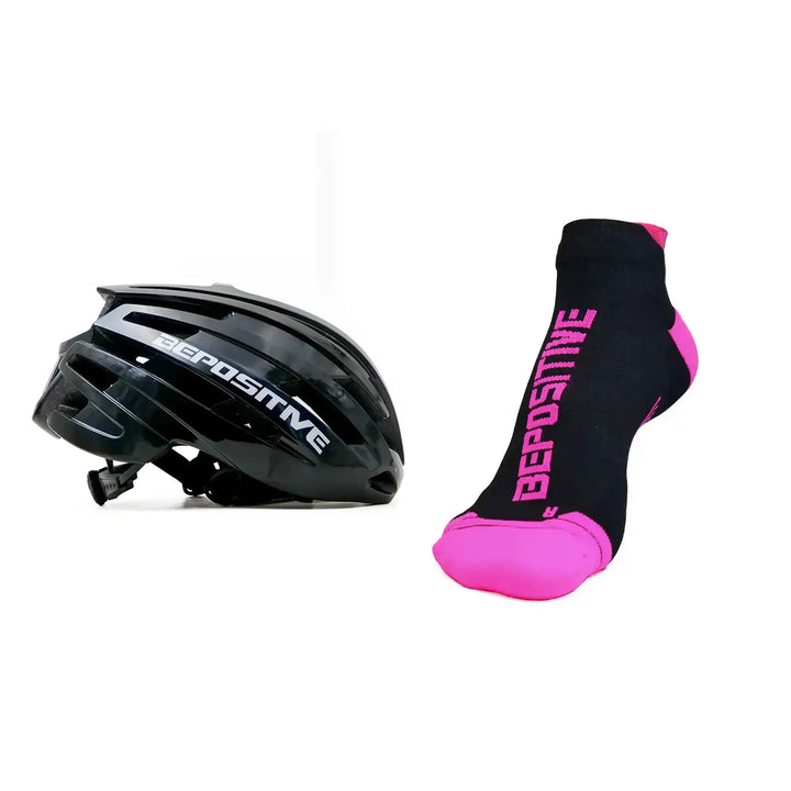 A black bepositive cycling helmet and pink bepositive Ankle socks on a white background