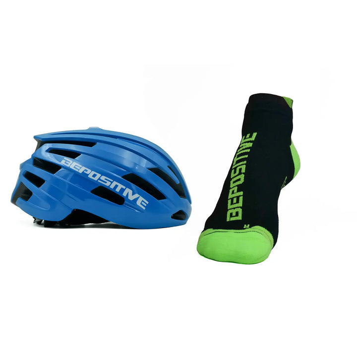 A blue bepositive cycling helmet and green bepositive Ankle socks on a white background