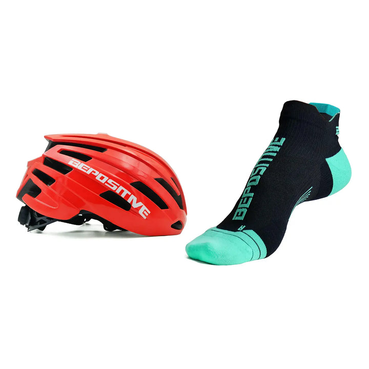 A orange bepositive cycling helmet and turquoise blue bepositive Ankle socks on a white background