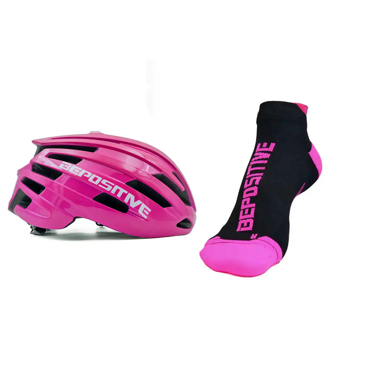 A pink bepositive cycling helmet and pink bepositive Ankle socks on a white background