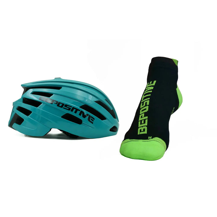 A turquoise blue bepositive cycling helmet and green bepositive Ankle socks on a white background