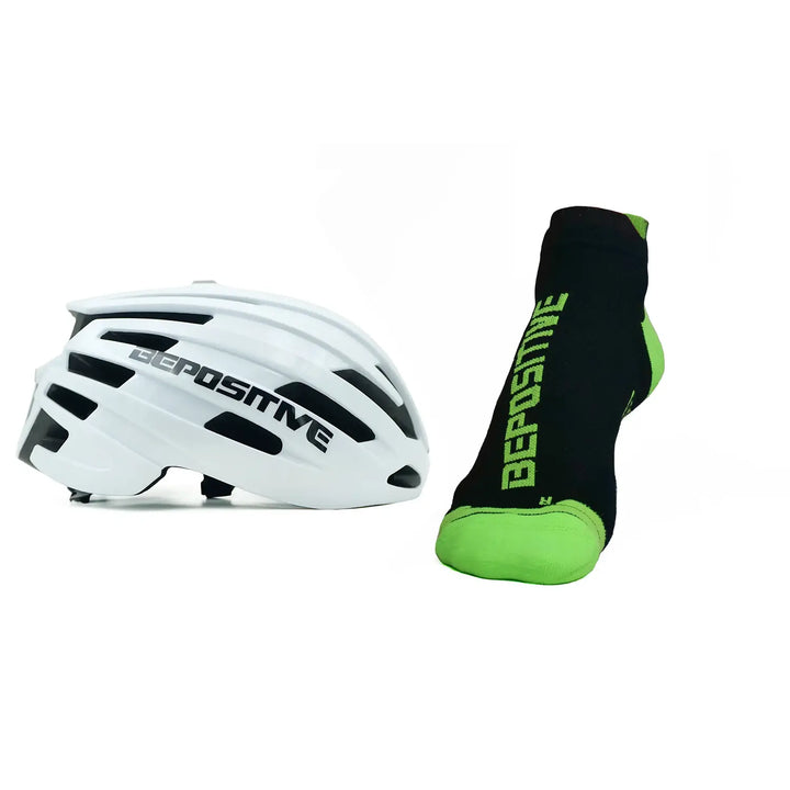 A white bepositive cycling helmet and  green bepositive Ankle socks on a white background