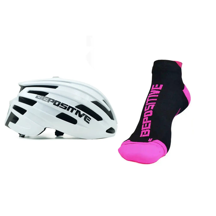A white bepositive cycling helmet and  pink bepositive Ankle socks on a white background