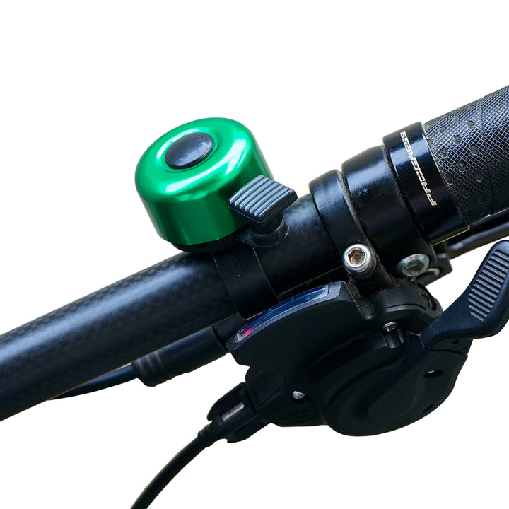 Cycle Chime Bell green fitted on a bicycle handle bar
