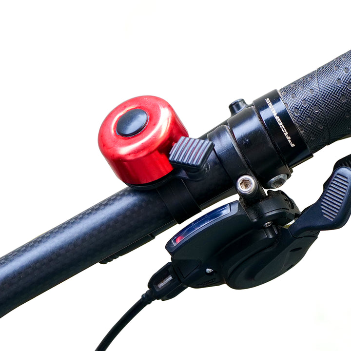 Cycle Chime Bell red fitted on a bicycle handlebar
