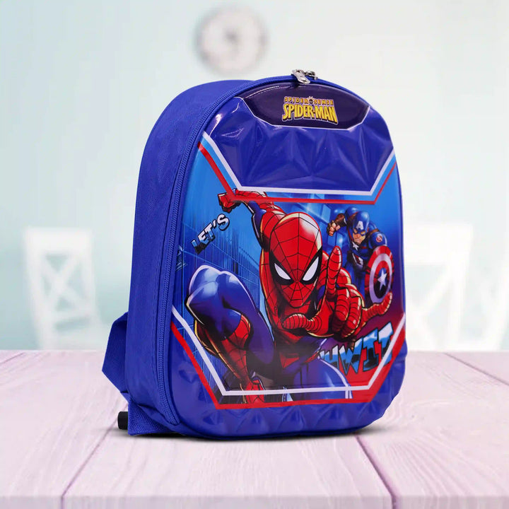 Blue backpack with a Spider-Man design on a light pink surface