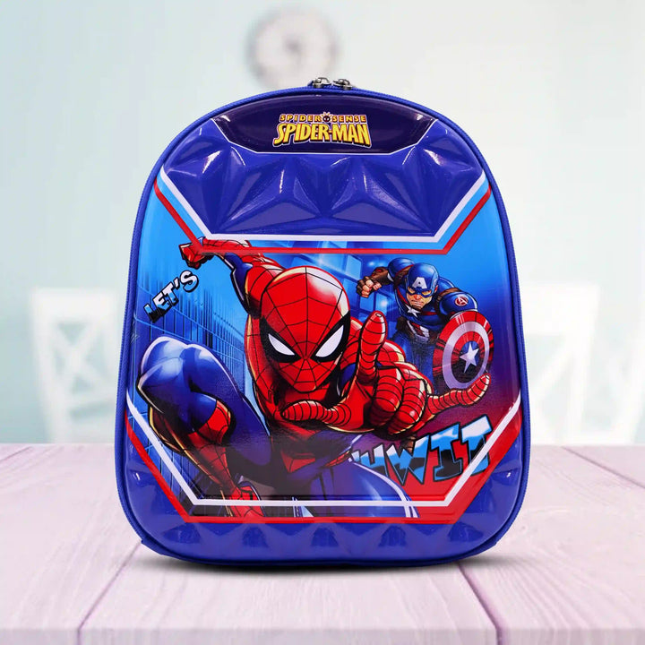 front view of a Spider-Man backpack on a light pink surface with a blurred background